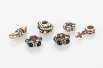 Pandora and other Charms partly with brilliant