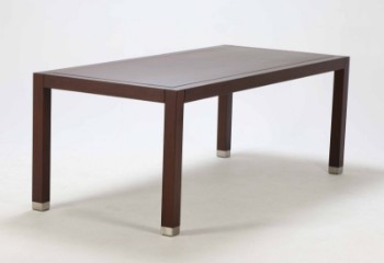 Flexform: Dining table in stained walnut