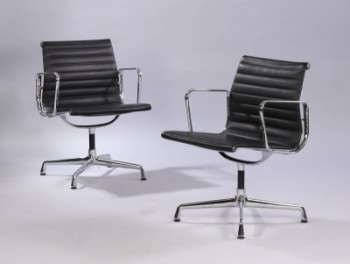 Charles Eames. A pair of armchairs in black leather, model EA-108 (2)