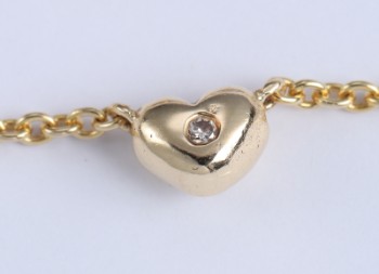 Frits Pedersen, Copenhagen. Necklace of 14 kt. gold with diamond-studded heart, 0.04 ct.