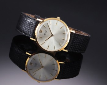 Rolex Cellini. Mens watch in 18 kt. gold with silver disc, approx. 1966