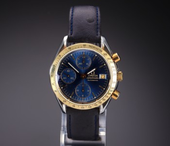 Omega Speedmaster Date. Mens watch in 18 kt. gold and steel with blue disc, approx. 1993