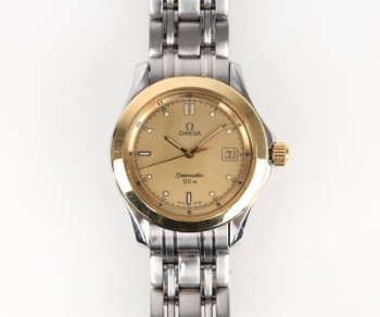 Omega: Mens wristwatch model Seamaster of 18 kt. gold and steel, Ø36 mm.