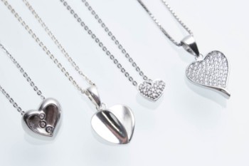Four heart-shaped pendants with sterling silver chains (4
