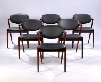 Kai Kristiansen. Six rosewood armchairs newly upholstered with black aniline leather, model 42 (6)
