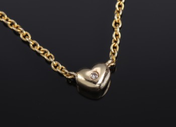 Frits Pedersen, Copenhagen. Necklace of 14 kt. gold with diamond-studded heart, 0.04 ct.