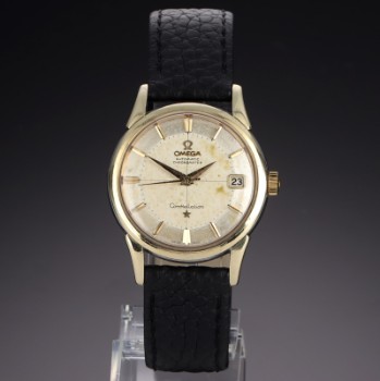 Omega Constellation. Vintage mens watch in steel with gold case and pie-pan dial, approx. 1960