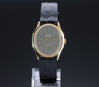 Ionic Classic. Mid-size ladies watch in gold-plated steel with dark dial, approx. The 1980s