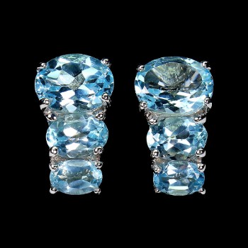 Earrings in rhodium-plated Sterling silver adorned with sky blue topazes.