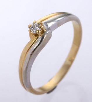 Modern solitaire ring of 18 kt. two-tone gold, approx. 0.08 ct.
