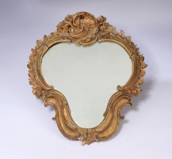 Rococo mirror in a frame of gilded wood and gesso, circa 1770