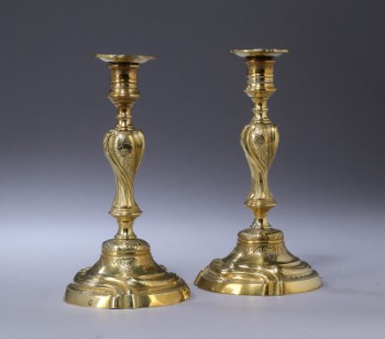 A pair of brass Rococo candlesticks, 18th century (2)