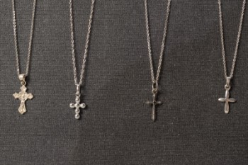 Four necklaces with sterling silver pendants (8)