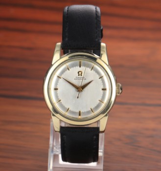 Omega Automatic. Vintage mens watch in steel with gold case, approx. 1954/55