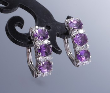 A pair of 18 kt amethyst and diamond studs. white gold, total 0.50 ct. (2)