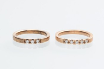 Pair of gold-plated silver engagement rings with diamonds, 0.09 and 0.15 ct. (2)