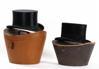 Two hats with hat boxes