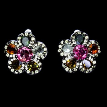 Earrings in rhodium-plated sterling silver adorned with tourmaline and sapphires.